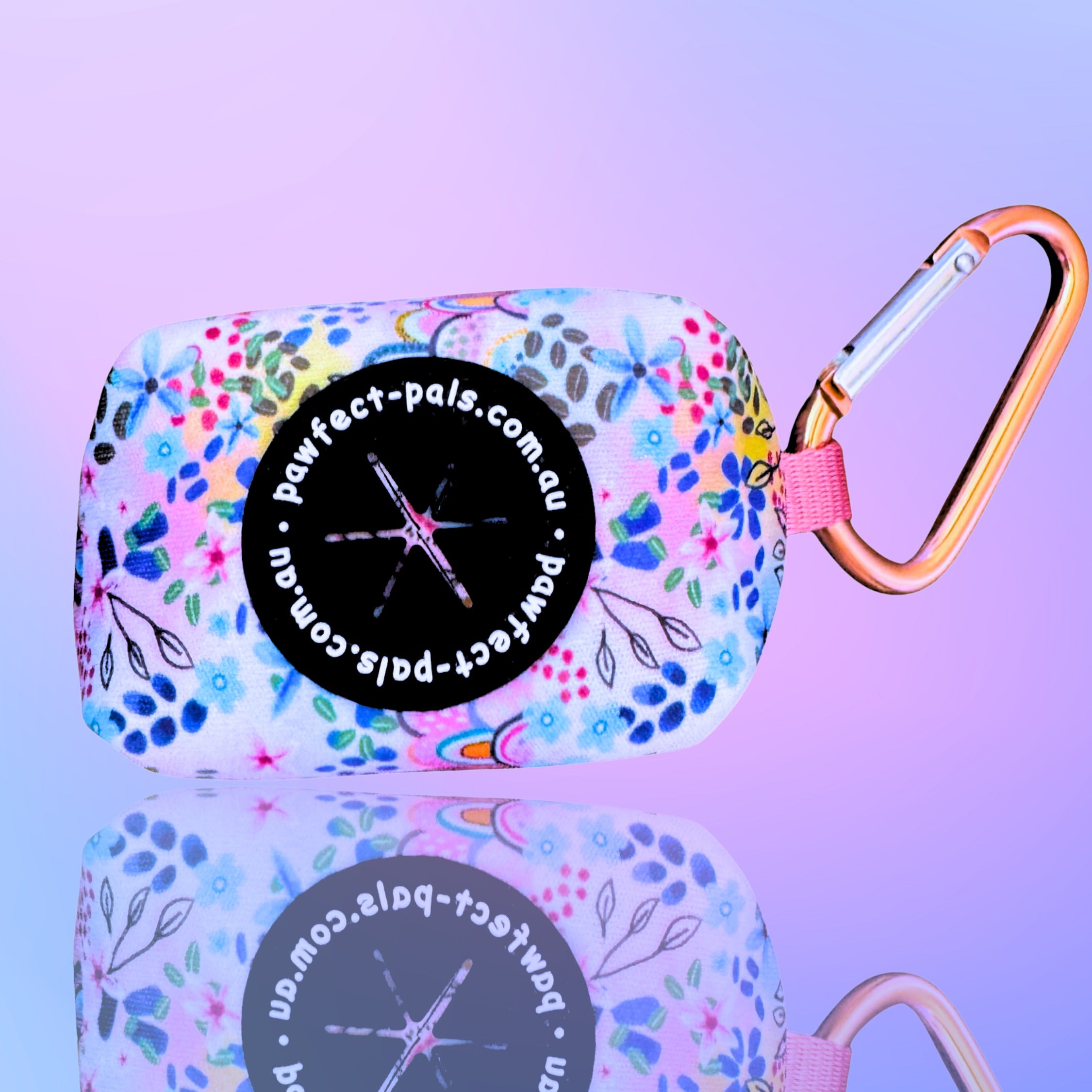 Floral-patterned product case with a carabiner on a purple background