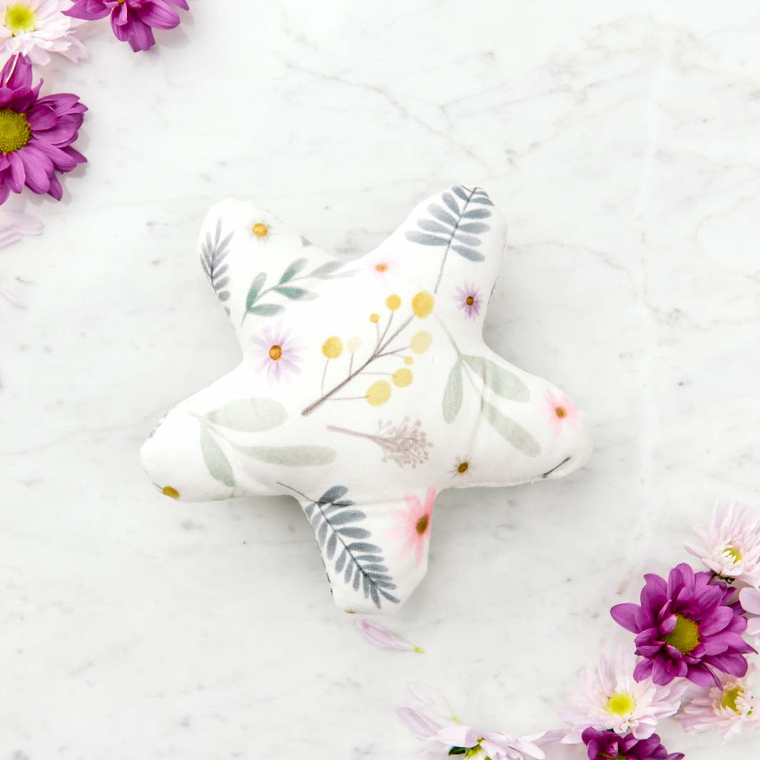 Free Daisy Baby toy comes with each Snuggle Bud dog bed.