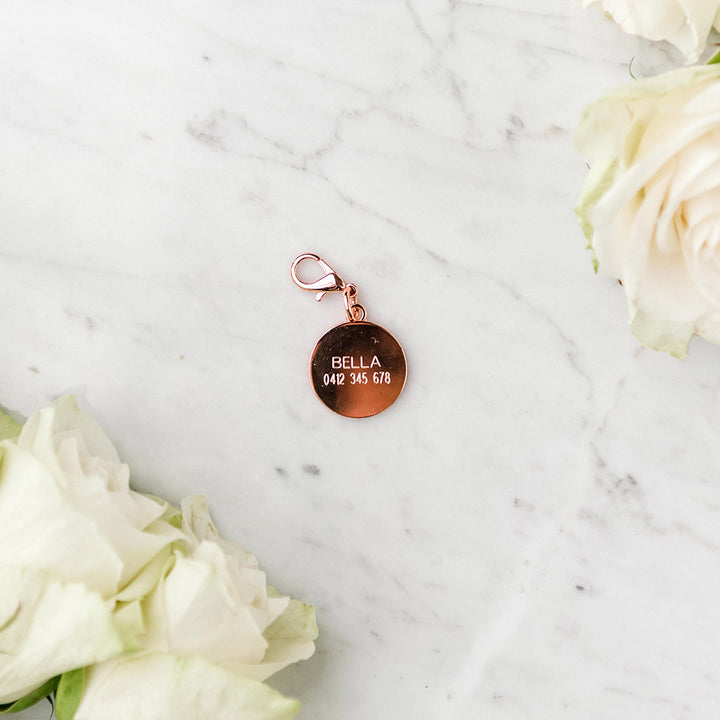Pawfect Pals engraved dog tag in rose gold.